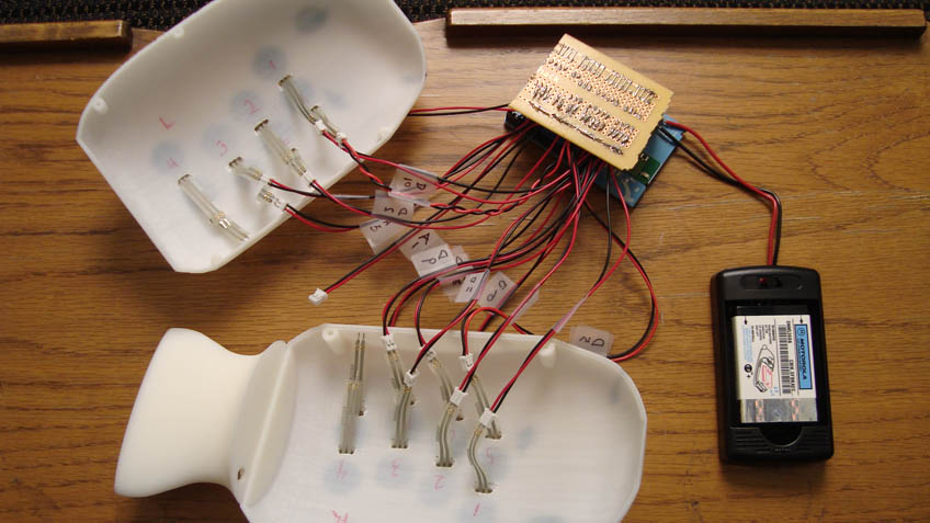 Toy inner workings showing wires and arduino board